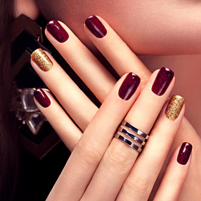 Burgundy Nails With Gold Glitter Accents