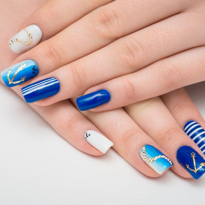 Premium Photo | A blue and white nail art design with seagulls on the sea