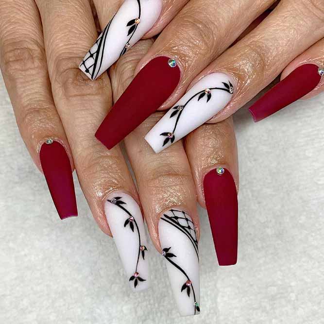 Red Nails with White and Black Design