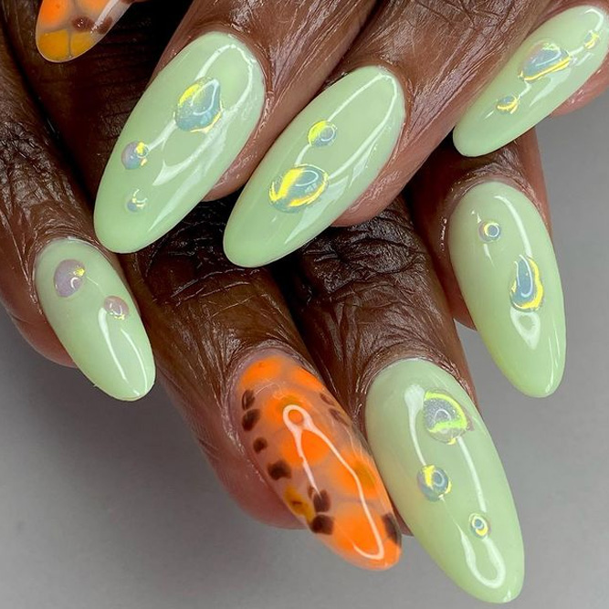 Beautiful nude manicure. Almond shaped nails. Nail design. Manicure with  gel polish. Close-up of the